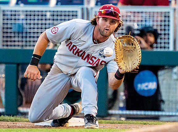 Razorbacks Peyton Stovall taking a throw at first base
